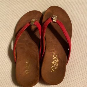 Red Vionic shoes.